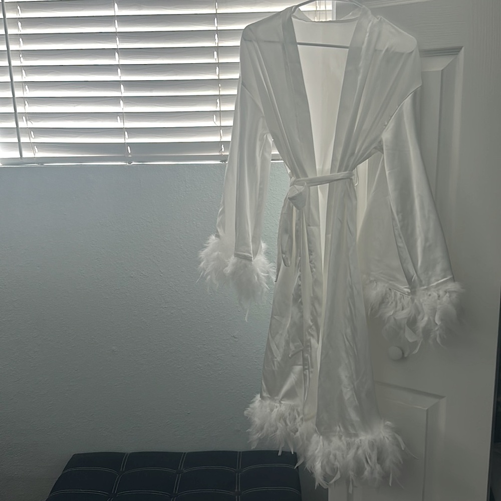 White robe with feathers